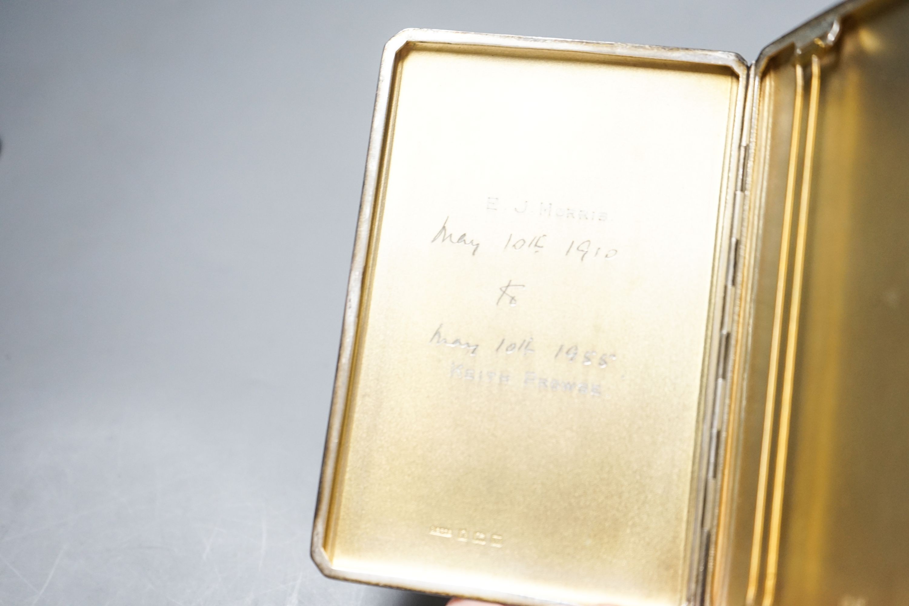 A Victorian engine turned silver card case, 95mm and a later silver cigarette case, gross 8.5oz.